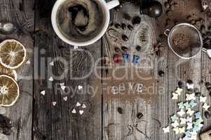 Coffee and an inscription love the gray wooden surface