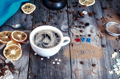 cup of black hot coffee on a gray wooden surface