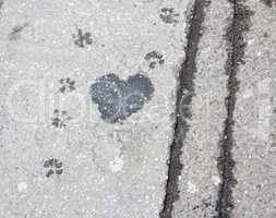 Heart on sidewalk - wet spot on the sidewalk