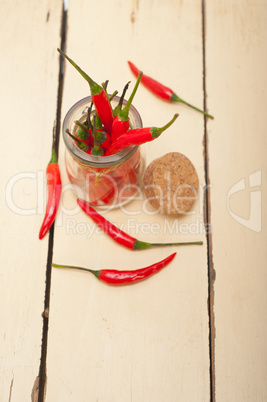 red chili peppers on a glass jar