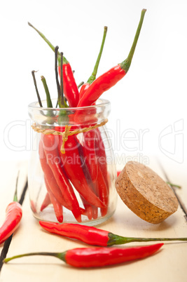 red chili peppers on a glass jar