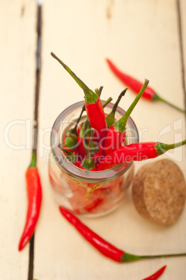 red chili peppers on a glass jar