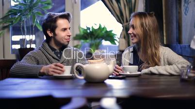 Romantic couple drinking tea at restaurant