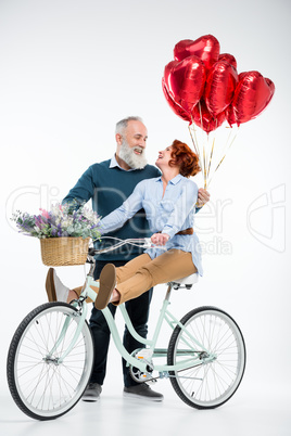 Mature couple with bicycle