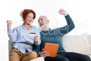 Mature couple shopping online