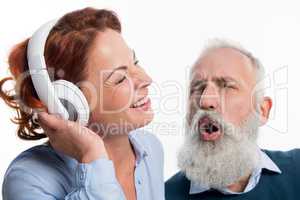 Mature couple with headphones