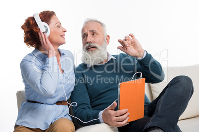 Couple using digital tablet