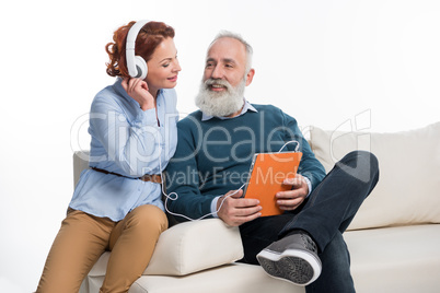 Couple using digital tablet