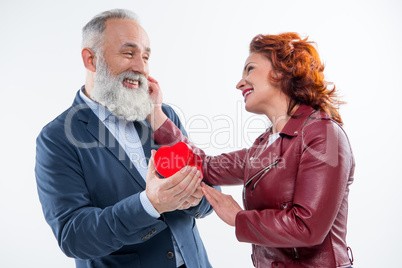 Mature couple with gift box
