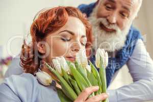 Mature couple with flowers