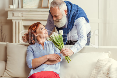 Mature couple with flowers