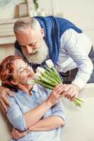 Mature couple with flowers