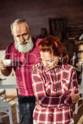 Mature man talking with woman
