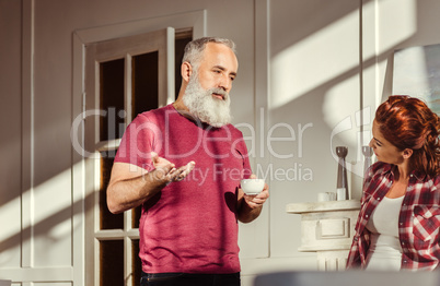 Mature man talking with woman