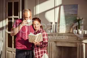 Mature couple reading book