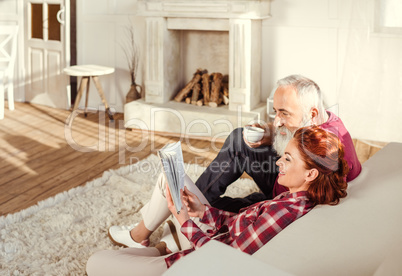 Mature couple reading book