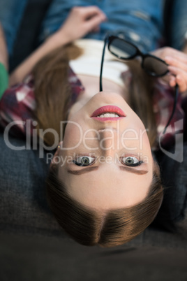 top view portrait of stylish woman with eyeglasses looking to camera