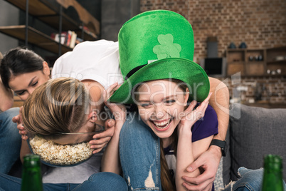 Young friends having fun during celebration of st patricks day