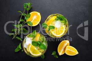 Lemon mojito cocktail with mint, cold refreshing drink or beverage, view from above