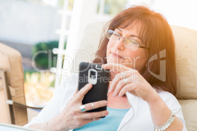 Attractive Middle Aged Woman Using Her Smart Phone