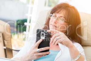 Attractive Middle Aged Woman Using Her Smart Phone