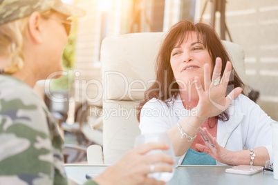Two Female Friends Enjoying Conversation Outside