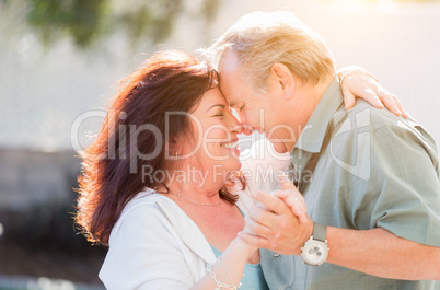 Middle Aged Couple Enjoy A Romantic Slow Dance Outside