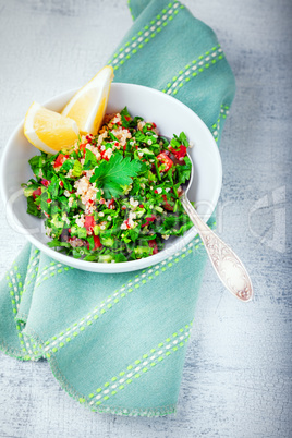 Quinoa tabbouleh salad on a wooden table