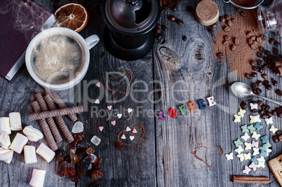 Abstract background with sweets and a cup of black coffee on a g