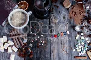 Abstract background with sweets and a cup of black coffee on a g