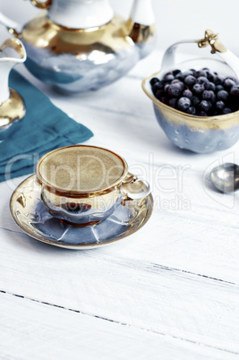 cup of black coffee espresso on a white wooden surface