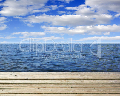 Wooden plank with sea and blue sky