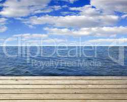 Wooden plank with sea and blue sky
