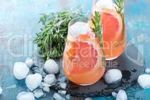 Grapefruit and thyme gin cocktail, refreshing drink with ice