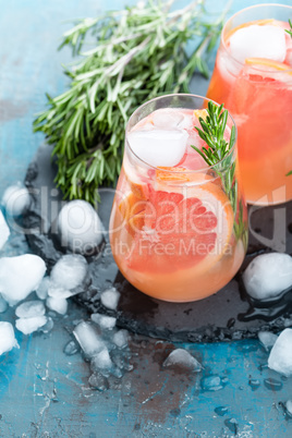 Grapefruit and thyme gin cocktail, refreshing drink with ice