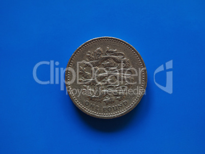 One Pound (GBP) coin, United Kingdom (UK) over blue