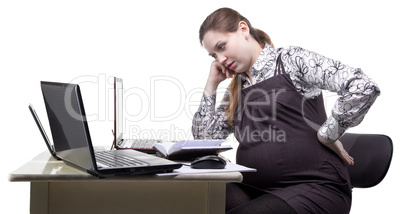 Tired pregnant woman at work