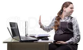 Lazy blond pregnant woman at work