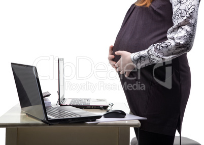 Standing pregnant woman in office