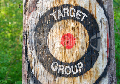 Target Group - tree with target and text in the forest