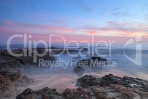 Long exposure of sunset over rocks