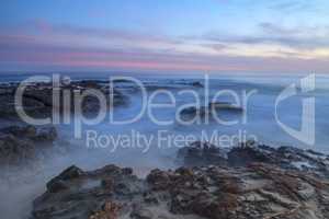 Long exposure of sunset over rocks