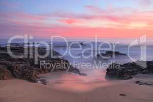 Long exposure of sunset over rocks