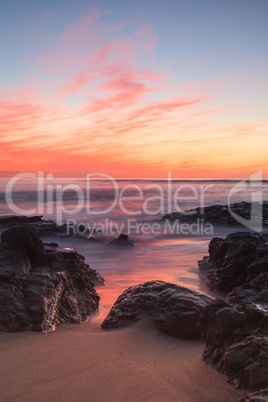 Long exposure of sunset over rocks