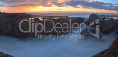 Long exposure of sunset over rocks