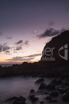 Moonset and sunset at Crescent Bay beach