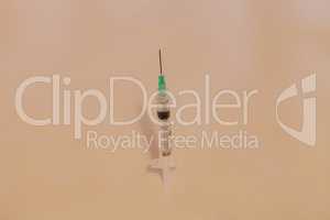 Long hypodermic needle ready for injection
