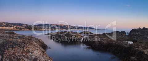 Long exposure of sunset over rocks