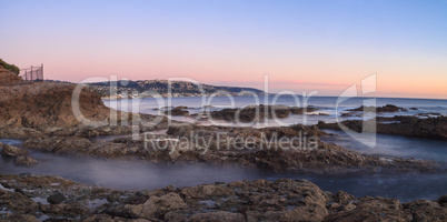 Long exposure of sunset over rocks