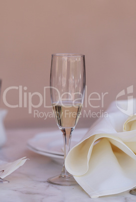 A place setting with a glass of champagne
